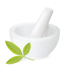 Healing herbs in white ceramic mortar