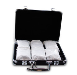 Drugs in a suitcase (really it's powdered sugar)