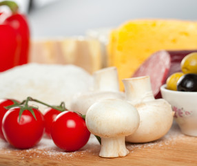 A set of food products for cooking pizza.