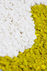 A closeup of colorful white and green stones sand