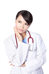 young woman doctor thinking