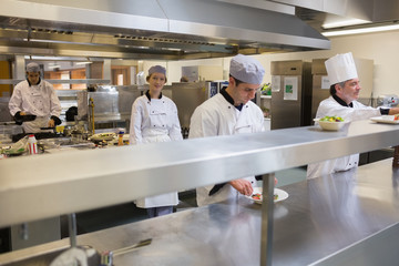 Restaurant kitchen with Chef's cooking