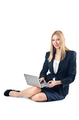 Businesswoman sitting on floor with laptop