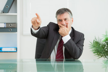 Thoughtful man pointing to something