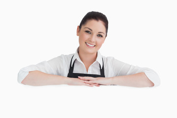 Smiling woman resting on her arms