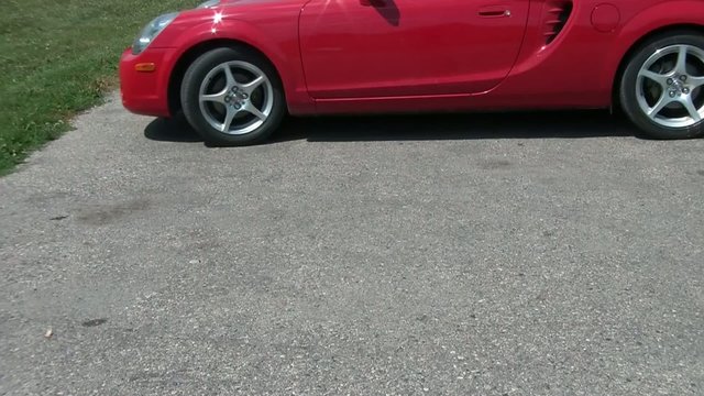 Red Sports Car Backing Up
