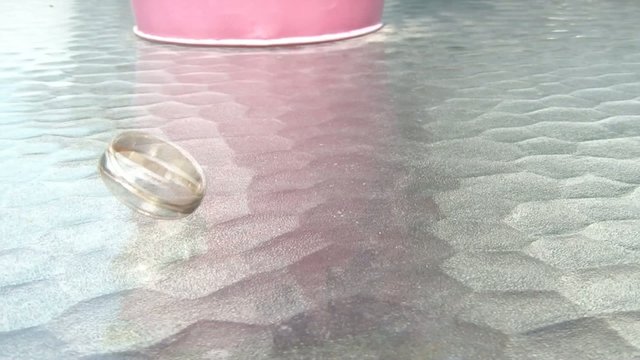 Wedding Ring Spinning on Glass