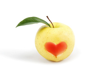 Fototapeta na wymiar Apple, which cut image of the heart on a white background.