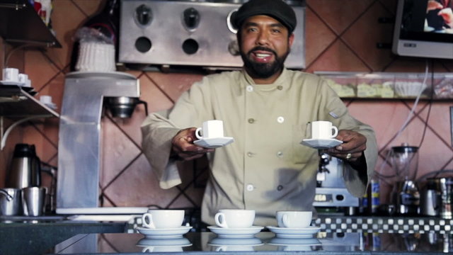 Latin Bartender with two cups of coffee