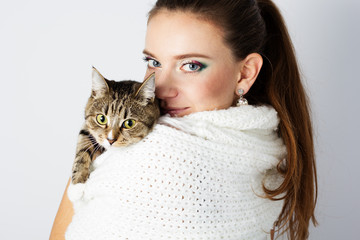 beautiful woman in white scarf with her cat