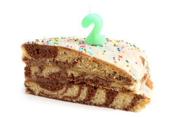 Slice of birthday cake with number two candle