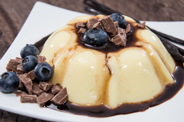 Fresh made Pudding with Berries and Sauce