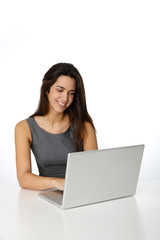 Fototapeta premium Cheerful young woman in front of laptop