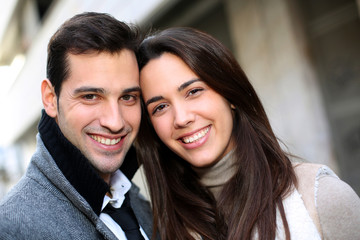Portrait of trendy couple in town