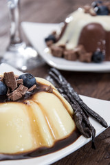 Different sorts of Pudding on wooden background