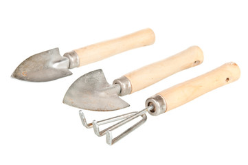 Old garden tools over a white background