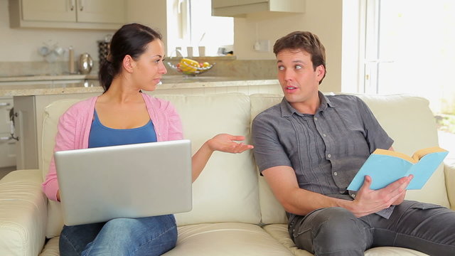 Man giving wife credit card for online shopping