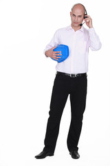 businessman with headset holding hard hat