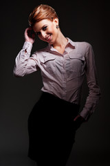 alluring woman posing over dark background