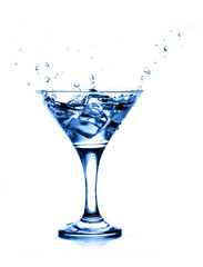 splashing into a martini isolated on white background