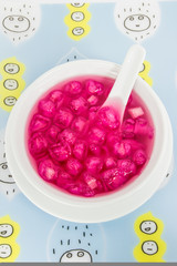 Thai style dessert called Tub Tim Krob on plastic sheet