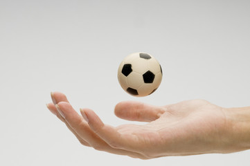 Fototapeta premium Soccer ball on female hand