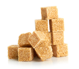 Brown cane sugar cubes isolated on white background