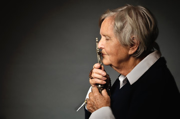 Praying senior woman.