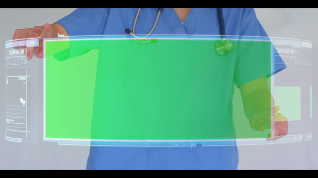 Doctor scrolling though interactive menu with copyspace