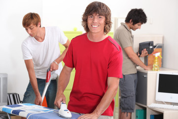 Fototapeta premium Boys cleaning the house