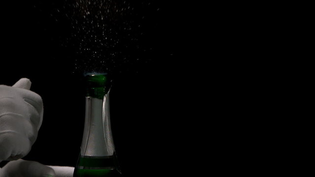 Person popping champagne cork