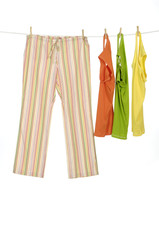 female dress trousers and colorful shirt clothespins on rope