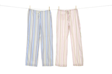 Two fashion leisure trousers clothespins on rope