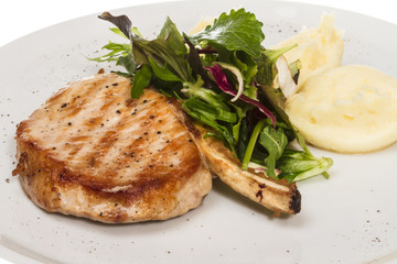 Grilled pork with salad and potato
