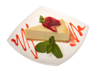a piece of strawberry cheesecake on whit