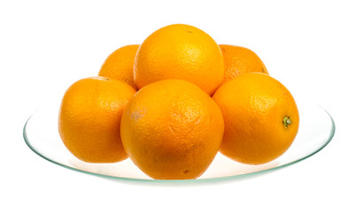 Heap of oranges in the dish