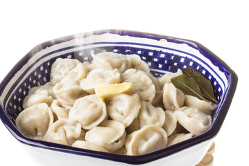 Bowl with traditional russian dish - pelmeni