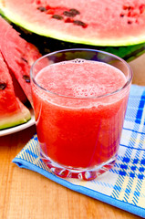Juice watermelon on a napkin and a board