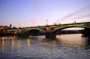 Obraz na płótnie Canvas Most Triana o zachodzie słońca, Sevilla