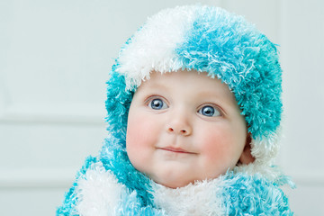 Cute baby at winter background