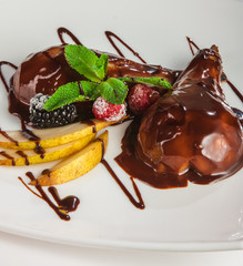 Dessert with pears in chocolate