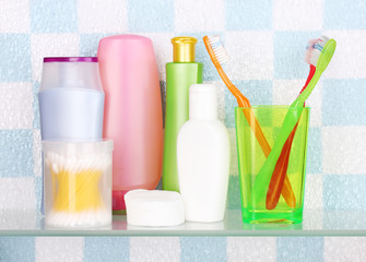 Shelf with cosmetics and toiletries in bathroom