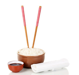 Bowl of rice and chopsticks isoalted on white
