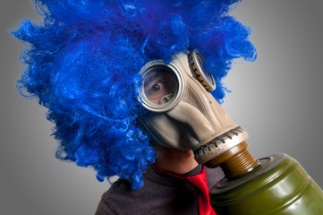 man with blue wig and gas mask