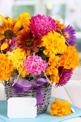 Beautiful bouquet of bright flowers with paper note close-up