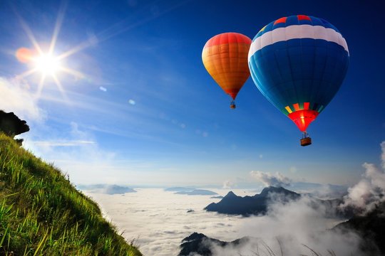 Colorful hot-air balloons flying over the mountain