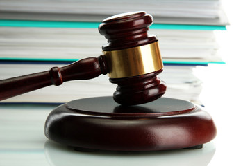 wooden gavel and folders, close up