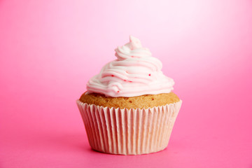 tasty cupcake, on pink background