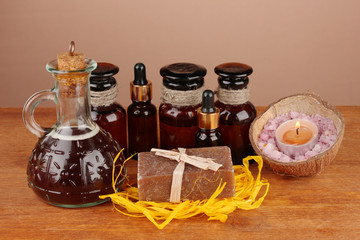 ingredients for soap making on brown background