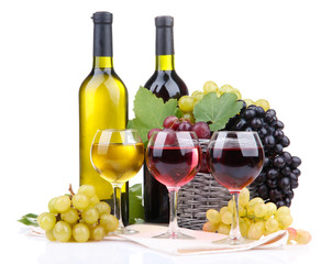 bottles and glasses of wine and grapes in basket, isolated